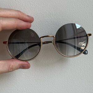 Miu Miu Gold Frame Sunglasses with Black Lenses